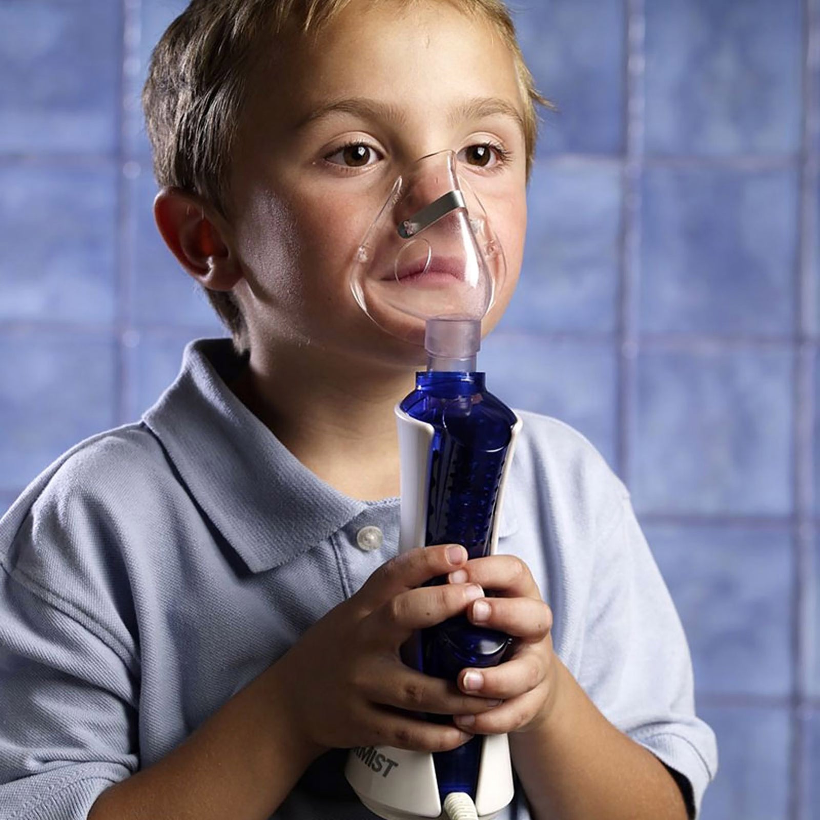 Boy using MyPurMist Handheld/Plug-In Steam Inhaler